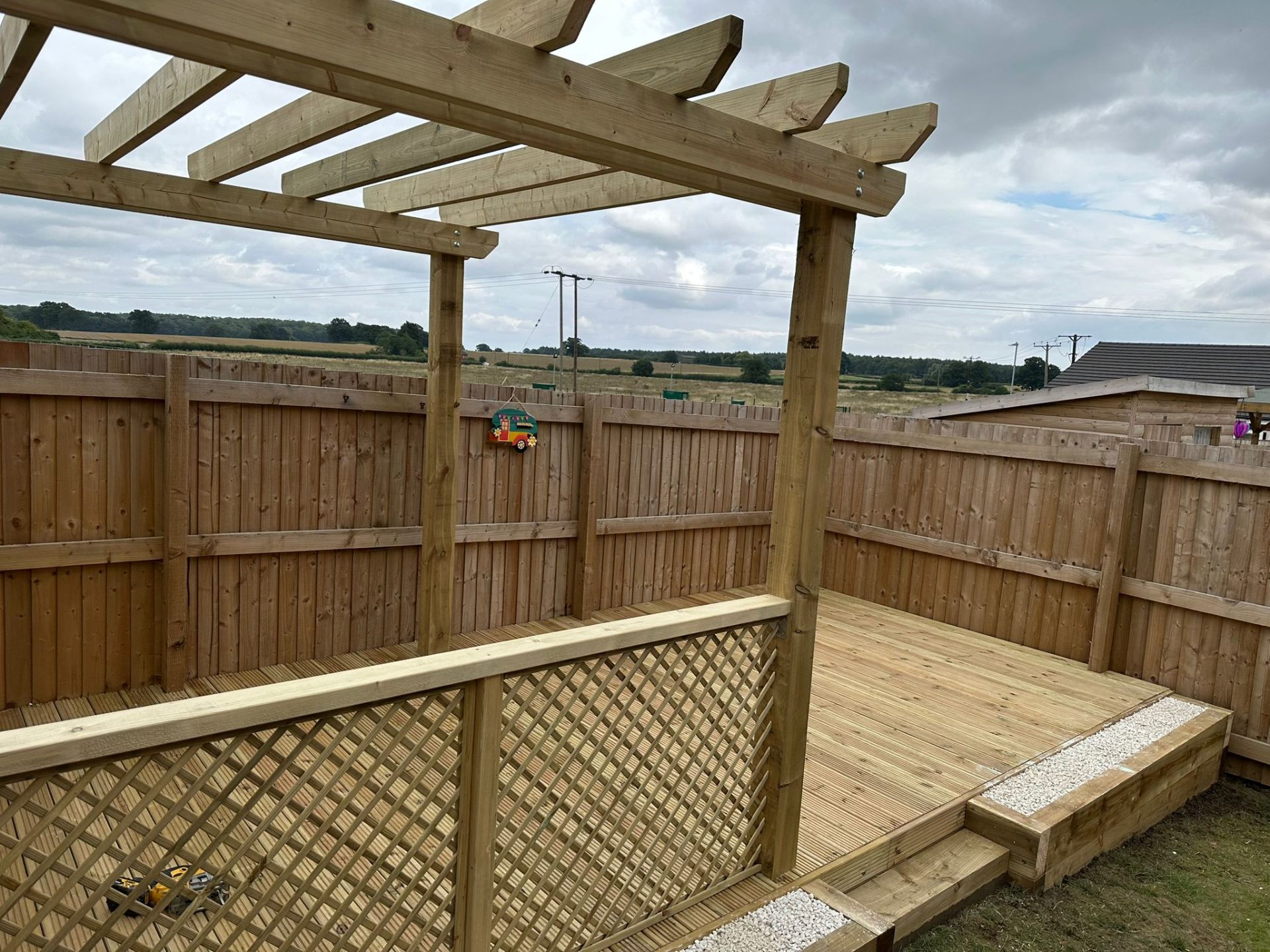 Pergola gazebo with trellis screening in a Nottinghamshire garden
