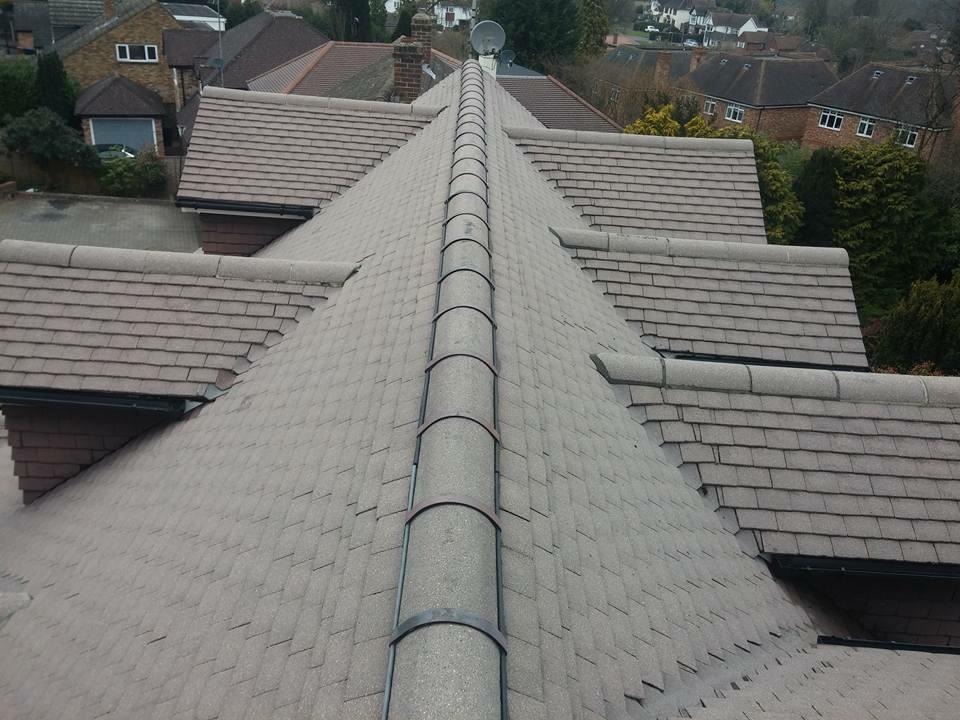 Tiled hip roof replacement with new ridge tiles, Nottinghamshire
